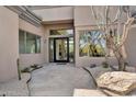 Inviting home entrance with stone walkway and desert-style landscaping at 6184 E Dusty Coyote Cir, Scottsdale, AZ 85266