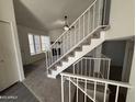 Open floor plan featuring a living room with a fireplace and staircase at 7905 W Thunderbird Rd # 305, Peoria, AZ 85381