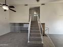 Staircase with carpeted steps and white railings leading to the upper level at 7905 W Thunderbird Rd # 305, Peoria, AZ 85381