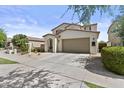 Charming two-story home featuring a neutral color palette and a spacious two-car garage at 9727 E Torino Ave, Mesa, AZ 85212
