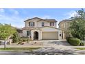 Charming two-story home featuring a neutral color palette and a spacious two-car garage at 9727 E Torino Ave, Mesa, AZ 85212