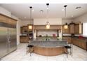 Gourmet kitchen features granite countertops, custom cabinets, and stainless steel appliances at 9842 E Celtic Dr, Scottsdale, AZ 85260