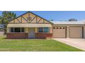 Charming single-Gathering home featuring a well-maintained front yard and a two-car garage at 10201 N 97Th Ave # B, Peoria, AZ 85345
