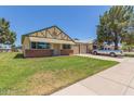 Charming single-Gathering home featuring a well-maintained front yard and a two-car garage at 10201 N 97Th Ave # B, Peoria, AZ 85345