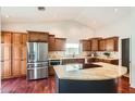 Spacious kitchen featuring stainless steel appliances, granite countertops, and ample cabinet space at 10522 E Bella Vista Dr, Scottsdale, AZ 85258