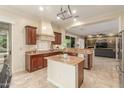 Well-appointed kitchen with granite countertops, stainless steel appliances, and an open design at 14426 W Becker Ln, Surprise, AZ 85379