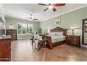 Relaxing bedroom features natural light, detailed millwork, and generous proportions for comfortable living at 14426 W Becker Ln, Surprise, AZ 85379