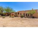 Beautiful home exterior with desert landscaping and charming curb appeal at 22050 N 90Th St, Scottsdale, AZ 85255