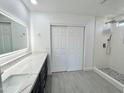 Bright bathroom features a modern vanity, shower, and stylish gray flooring at 22261 W Tonto St, Buckeye, AZ 85326