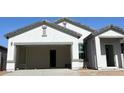 New home features neutral stucco, concrete driveway, and unfinished front yard at 29747 N Oak Dr, Florence, AZ 85132