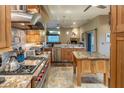 Spacious kitchen featuring granite countertops, stainless steel appliances, and a view to living area at 30330 N 77Th Pl, Scottsdale, AZ 85266
