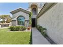 Welcoming home entrance featuring manicured landscaping and a well-lit pathway to the front door at 3202 E Orange Dr, Phoenix, AZ 85018