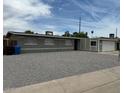 Single-story home featuring low-maintenance landscaping and an attached garage at 3608 W Hazelwood St, Phoenix, AZ 85019