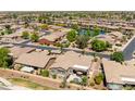 Charming community with lake, lush landscaping, and single-Gathering homes at 42293 W Good Vibrations Ln, Maricopa, AZ 85138