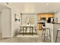 Dining room featuring lots of natural light and a bar area at 4704 E Paradise Village N Pkwy # 236, Phoenix, AZ 85032