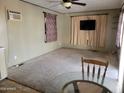 Spacious living room perfect for entertaining, and cozy carpeting at 61 W Southern Ave # 63, Mesa, AZ 85210