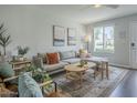 Bright living room featuring a comfy sectional sofa, area rug and decor at 6945 E Osborn Rd # E, Scottsdale, AZ 85251