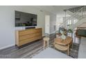 Open-concept living area with contemporary furnishings, stairs, and stylish accents at 6945 E Osborn Rd # E, Scottsdale, AZ 85251