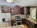 Spacious kitchen with stainless steel appliances, granite counters, and abundant cabinet space at 723 E Moreland St, Phoenix, AZ 85006