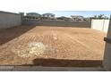 Graded dirt backyard awaiting personalization for landscaping and outdoor enjoyment at 820 W Lark Dr, Queen Creek, AZ 85140