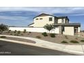 An exterior street view showing a landscaped front yard and white brick fence at 820 W Lark Dr, Queen Creek, AZ 85140