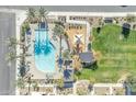 Community amenities featuring a large pool, playground, and green space for recreation and relaxation at 8313 E Impala Ave, Mesa, AZ 85209