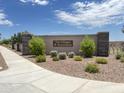 Attractive community entrance sign surrounded by lush landscaping and a welcoming atmosphere at 9839 W Agora Ln, Tolleson, AZ 85353
