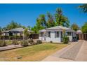 Home exterior featuring mature landscaping and inviting curb appeal at 1110 W Heatherbrae Dr, Phoenix, AZ 85013