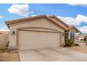Charming single-story home with a 2-car garage, beautiful windows and desert landscaping at 13137 W Wilshire Dr, Goodyear, AZ 85395