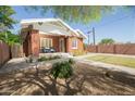 Charming brick home with manicured lawn, sidewalk, and lovely exterior at 1650 N 10Th St, Phoenix, AZ 85006