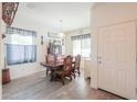 Cozy dining room featuring a wood table, matching chairs, and decorative accents at 19365 N Pietra Dr, Maricopa, AZ 85138
