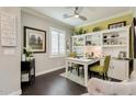 Bright home office featuring built-in shelves, hardwood floors, neutral paint, and modern fixtures at 1952 W Yellowstone Way, Chandler, AZ 85248