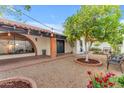 Beautiful front yard with desert landscaping, string lights and charming exterior at 2018 E Balboa Dr, Tempe, AZ 85282