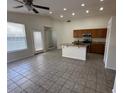 Spacious living room boasts high ceilings, abundant natural light, and an open floor plan at 21192 N 80Th Ln, Peoria, AZ 85382