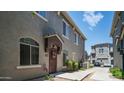 Beautiful townhome with neutral stucco facade and manicured landscaping in quiet neighborhood at 2150 W Alameda Rd # 1424, Phoenix, AZ 85085