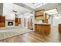 Bright, open living space with fireplace, wood floors, vaulted ceilings and staircase at 225 S Pioneer -- # 36, Mesa, AZ 85204