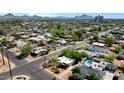 An aerial view shows a home with a backyard pool nestled in a charming, well-established neighborhood at 2545 N 14Th St, Phoenix, AZ 85006
