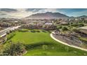Stunning aerial view showcases the community park, lush green space, and mountain backdrop at 2597 E Hickory St, Gilbert, AZ 85298