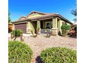 Charming single-story home with desert landscaping, covered porch, and beautiful stone accents at 2597 E Hickory St, Gilbert, AZ 85298