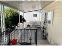 Spacious covered patio with wrought iron railing for outdoor living and relaxation at 305 S Val Vista Dr # 243, Mesa, AZ 85204
