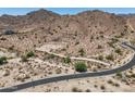 Desert homesite showing access roads, desert landscape, and scenic mountain backdrop at 3284 W Highlands Dr, Buckeye, AZ 85396