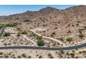 Desert homesite displaying access roads and views of surrounding mountain at 3284 W Highlands Dr, Buckeye, AZ 85396
