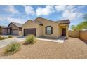 A lovely single-story home with desert landscaping, a welcoming entrance, and a two-car garage at 33731 N Bowles Dr, San Tan Valley, AZ 85144