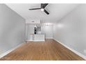 Spacious living area with sleek ceiling fan and open layout to kitchen at 3416 N 44Th St # 70, Phoenix, AZ 85018