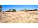 Large lot provides ample space and features desert landscape with a home situated in the background at 35019 N Central Ave, Phoenix, AZ 85086