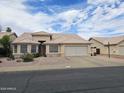 Charming single-story home with tile roof, desert landscaping, and a spacious two car garage at 3580 W Dublin St, Chandler, AZ 85226
