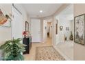 Warm and inviting foyer with neutral tones, tile flooring, and space for decor at 4245 E Ficus Way, Gilbert, AZ 85298