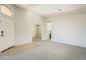 An open-concept home design allows for easy movement from room to room at 43727 W Wade Dr, Maricopa, AZ 85138
