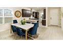 Bright dining room with stylish table set, seamlessly connecting to the modern kitchen at 5109 E Helena Dr, Scottsdale, AZ 85254