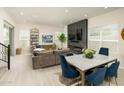 Open-concept layout showcasing the living room and dining area with natural light and modern decor at 5109 E Helena Dr, Scottsdale, AZ 85254